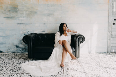 woman sitting on the couch with robe