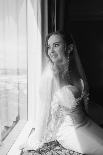 bride looks out window