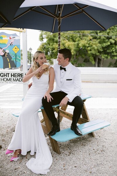 couple on a bench eating icecream