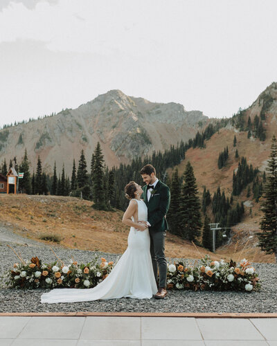 Bride and groom in field at Colorado wedding