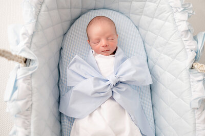 baby in basinet for newborn photos little boy