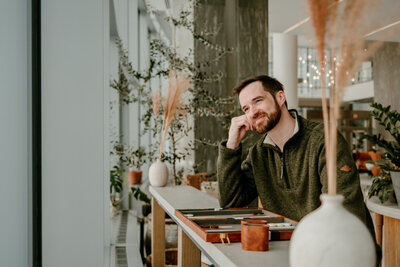 Twin Cities dating photographer guiding a client through expert posing tips.