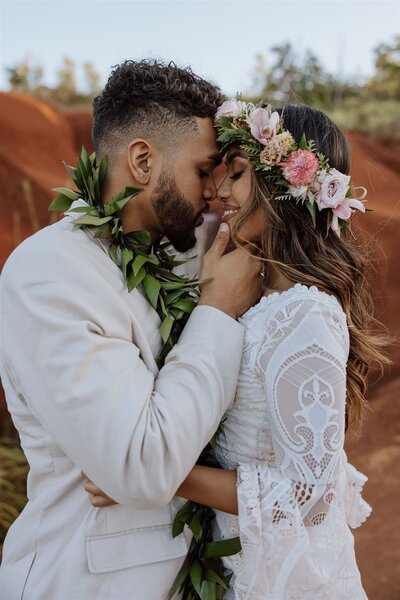 hawaii bride and groom with heads together