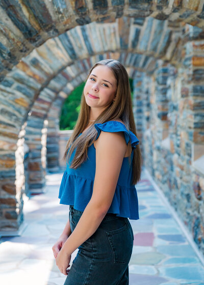  senior pictures penn yan ny girl wearing blue by arch of Garrett Chapel