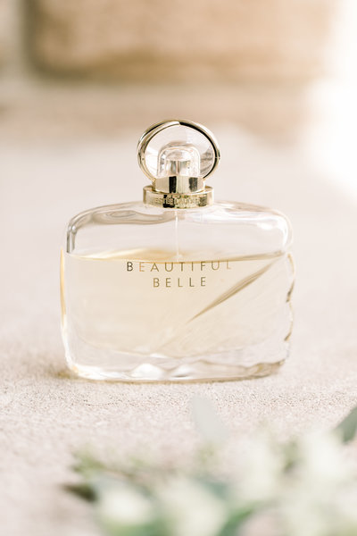 Detail shot of perfume on the wedding day
