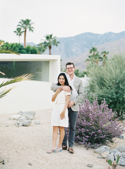 Bride and groom wearing casual wedding outfits at their elopement venue in Palm Springs