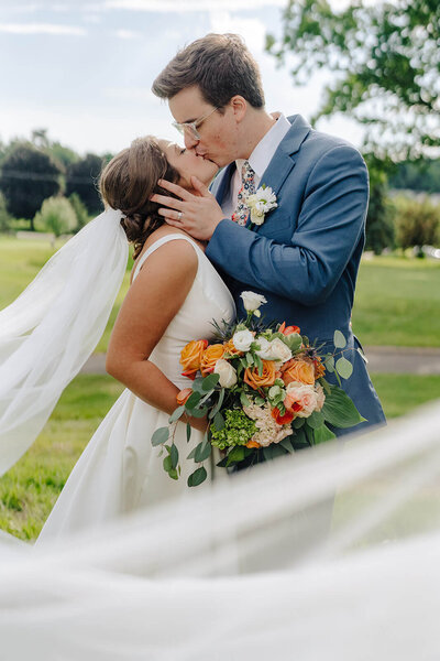 Bride and groom kissing at Finger Lakes wedidng new yrok