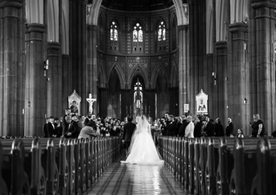 Couple sitting in the city after wedding ceremony shot on 120 film
