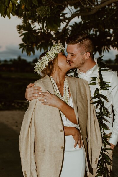 bride and groom kissing on oahu wedding