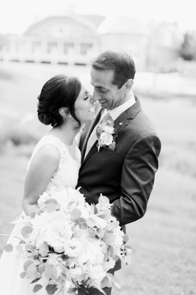 bride and groom laughing black and white portrait