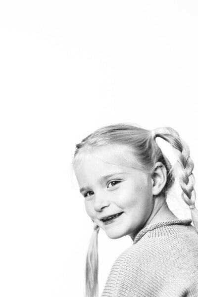 Black and white image of girl with pigtail braids