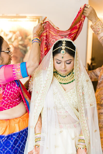 South Asian bride gets ready with her parents by Charleston wedding photographer Dana Cubbage.