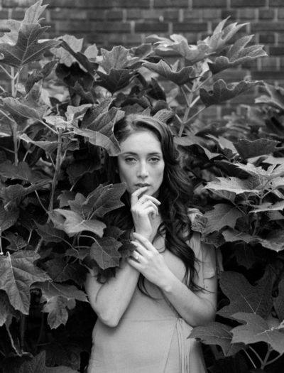 Dark haired woman in among the leaves of a tree | Black and White Portrait | Pittsburgh Photographer | Anna Laero