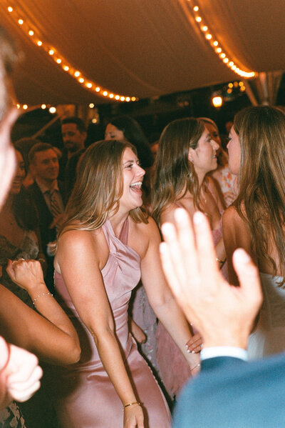 Bride jumps into groom's arms on dance floor at Glen Foerd Estate in Philadelphia, PA