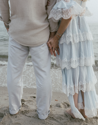 woman wrapping arms around man smiling