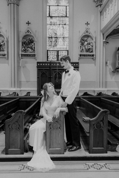 Bride looking up at her military groom at a chapel in Annapolis, Maryland
