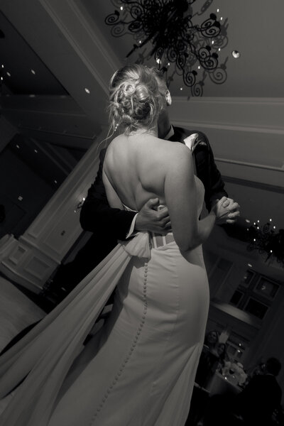 Newlyweds sitting on a dock
