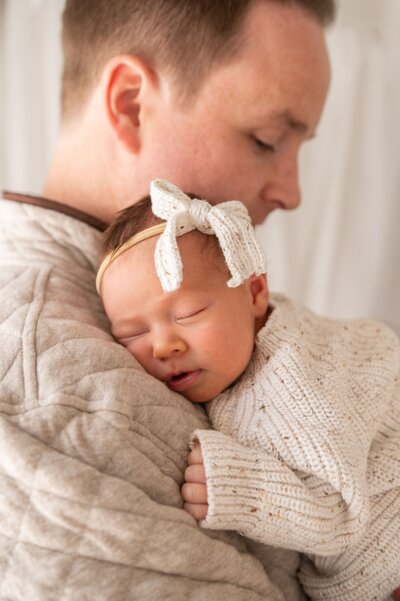 newborn foot being held my mom in maryland