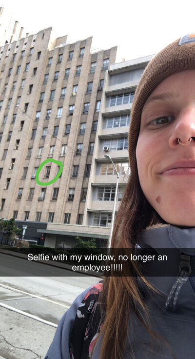 Snapchat of a selfie with text "selfie with my window, no longer an employee" with a green hand-drawn circle around the window.