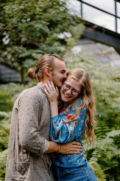 Guy kissing girls cheek