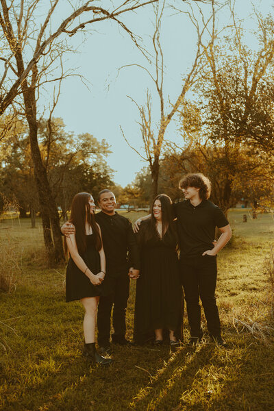 Stunning golden hour family session in a field in Buffalo Gap, TX