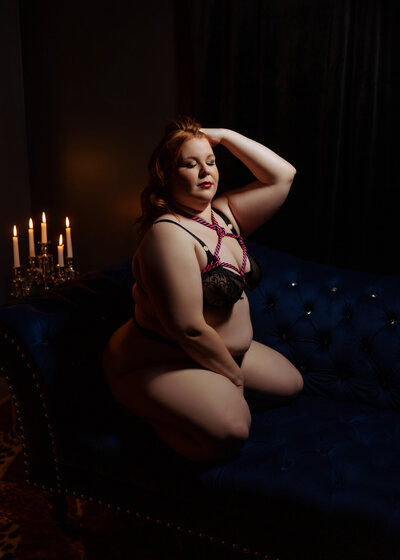 plus size woman during boudoir session in black lingerie with shibari ropes