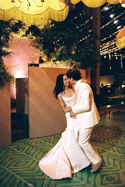 A joyful first dance at Casa de Campo Resort & Villas, captured on film by Asia Pimentel — a warm, elegant wedding celebration in the Dominican Republic.