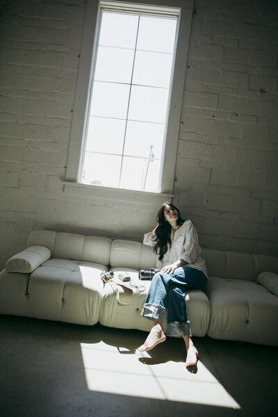 boise photographer Erica Rochelle sits on staircase