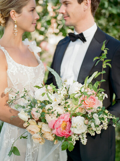 Bride and groom during the wedding ceremony with bridal bouquet