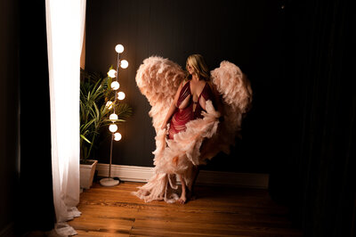 Photographer guiding client through expert poses during boudoir session in LaGrange KY