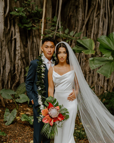 couple standing in forest