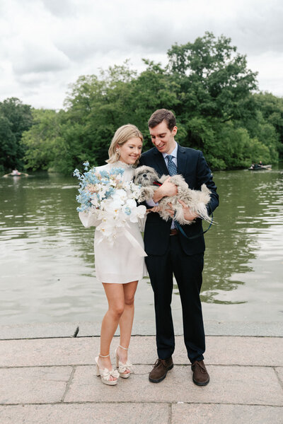 summer central park elopement couple at the lake holding dog