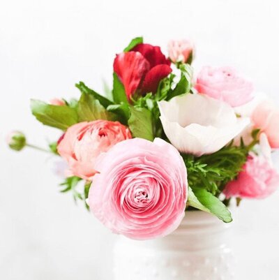 Image of pretty red, white, pink flowers in a vase
