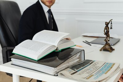 Man with books working at desk