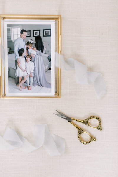 Maryland family photography proof prints in a gold glass box