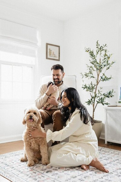 A warm family moment featuring a dog and their newborn during a Cleveland photography session.