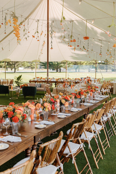 Hanging flowers and rustic decor at Boyne Mountain Beach House wedding reception.