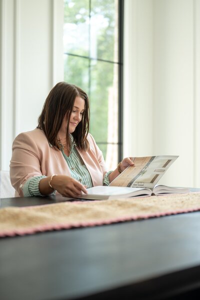 Chloe with realtor partner discussing staging plan in new listing