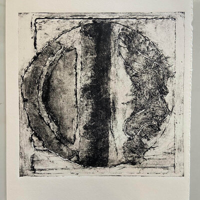 A finished black-on-white print featuring mirrored heart and scroll linework from the line reversal technique.