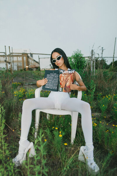 woman sitting on a chair outside on a chair