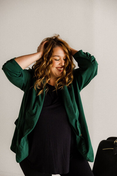 Playful portrait of Jacksonville wedding planner known for her warm, expert approach to full-service event planning.