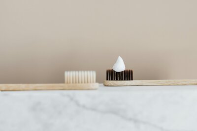 Two toothbrushes next to each other for gummy smile precare