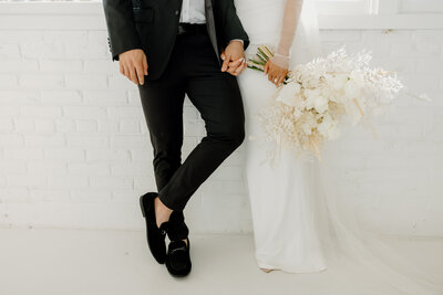 couple walking on courthouse steps after city elopement