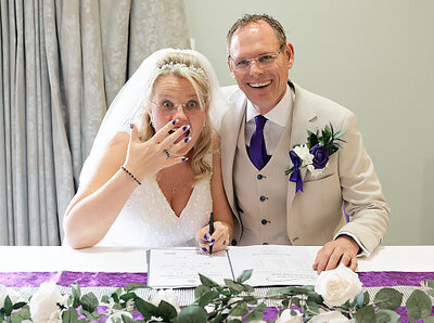 bride and groom laughing out loud during their wedding breakfast