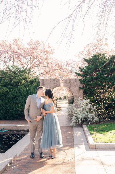 Engagement session at the Enid A Haupt garden in Washington DC magnolia bloom