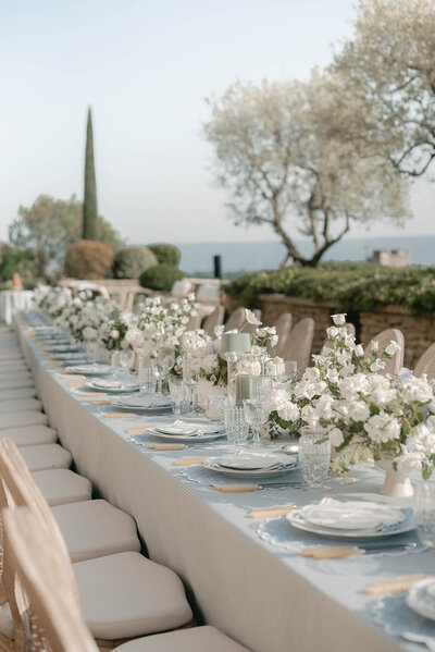 Blue florals and greenery in vintage terra cotta pots for a French countryside wedding in Gordes, France