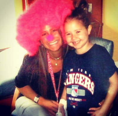 Therapist smiling with little girl