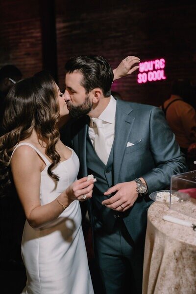 Bride and groom kissing during their event planned by a wedding coordinator in Houston.