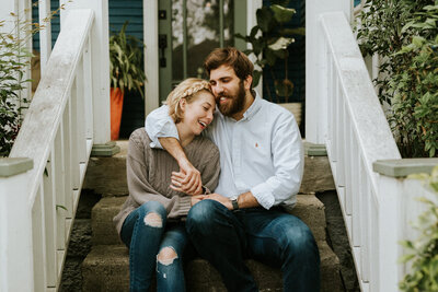 Couple sitting on steps embracing