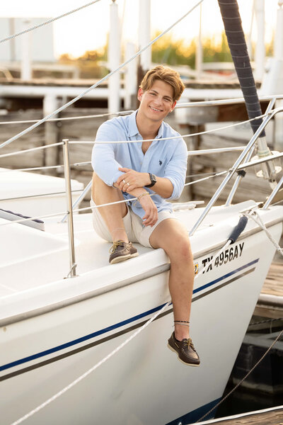 senior-guy-smiling-on-sailboat